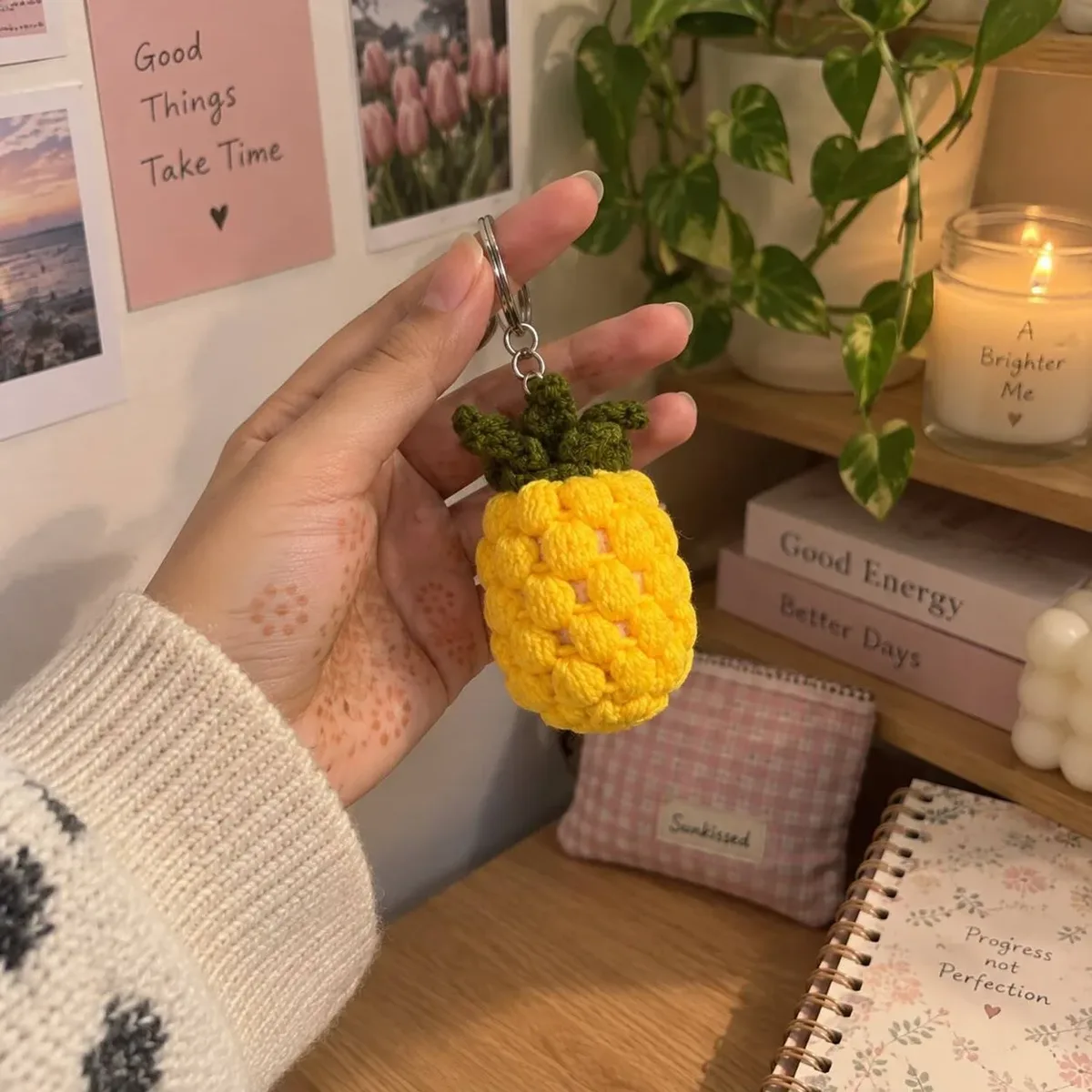 Crochet Pineapple Keychain — Yellow, held in a hand indoors, handmade by Felofey